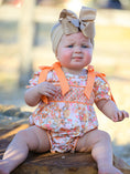 Load image into Gallery viewer, Peach Bow Smocked Floral Baby Bubble
