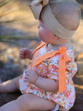 Load image into Gallery viewer, Peach Bow Smocked Floral Baby Bubble
