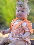 Load image into Gallery viewer, Peach Bow Smocked Floral Baby Bubble
