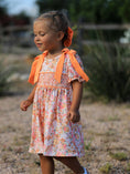 Load image into Gallery viewer, Peach Bow Smocked Floral Girl Dress
